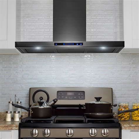 black range with stainless steel wall hood white cabinets|black stainless steel vented hood.